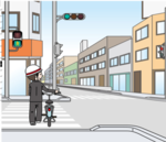 自転車で横断歩道を押して渡っている画像